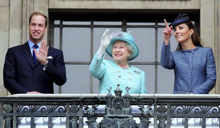 Image: Britain's Queen Elizabeth, Prince William, and the Duchess of Cambridge wave from the balcony during a visit  to the Council House, in Nottingham